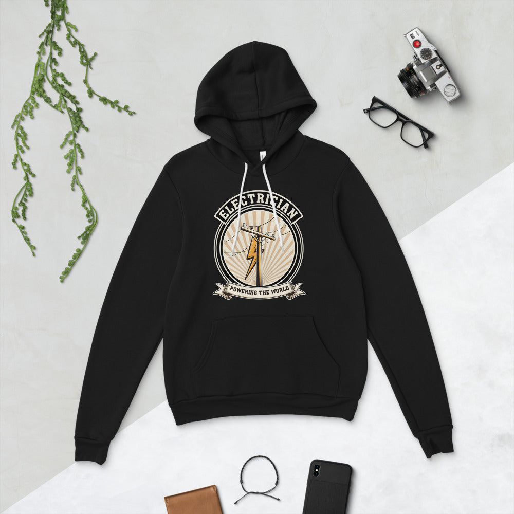 Powering The World electrician emblem hoodie — Black, flat lay