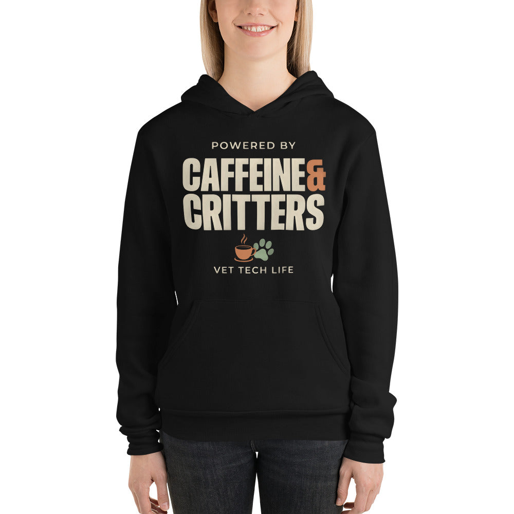 Powered by Caffeine & Critters funny vet tech hoodie — Black, on model