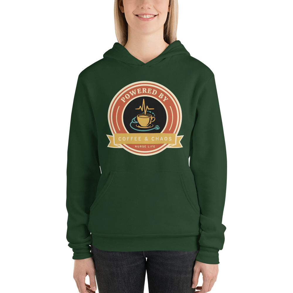 Powered by Coffee & Chaos retro nurse badge hoodie — Forest, on model