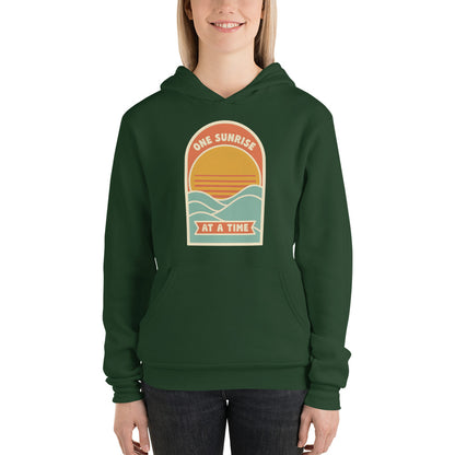 One Sunrise at a Time retro sunrise hoodie — Forest, on model