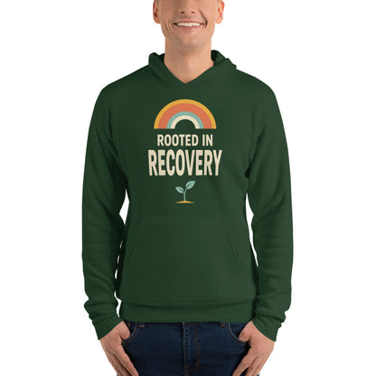 Rooted in Recovery retro rainbow hoodie — Forest, on model