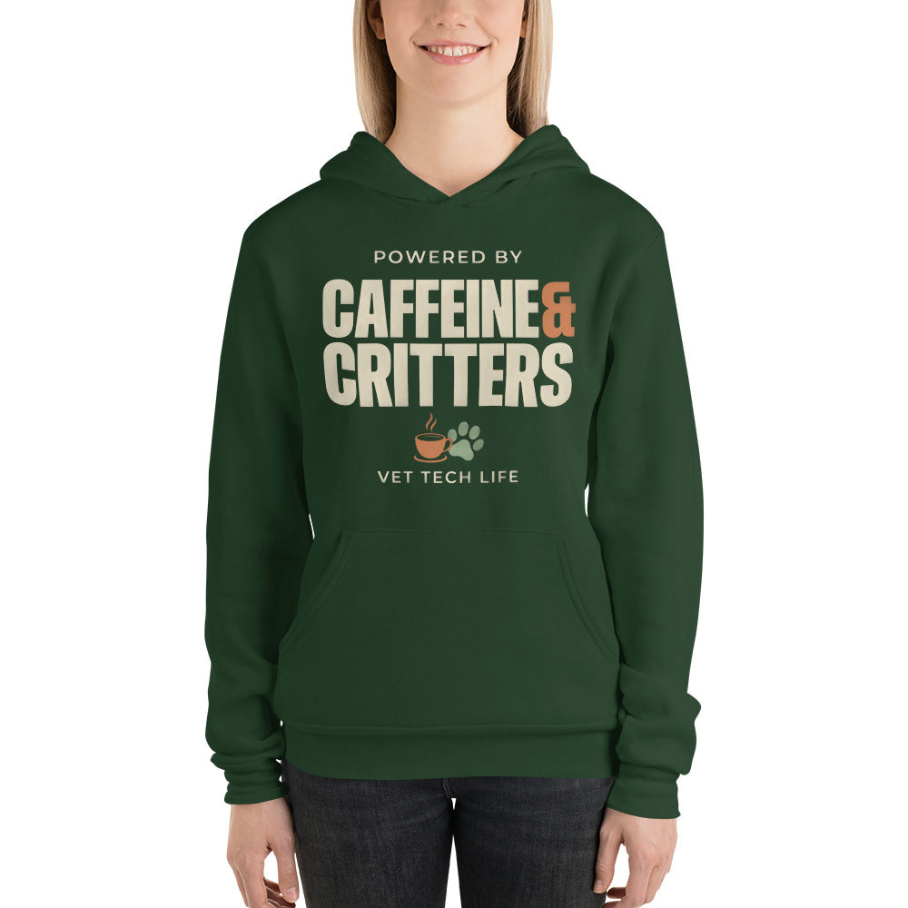Powered by Caffeine & Critters funny vet tech hoodie — Forest, on model