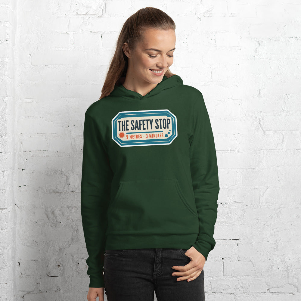 The Safety Stop vintage scuba diving travel decal hoodie — Forest, on model