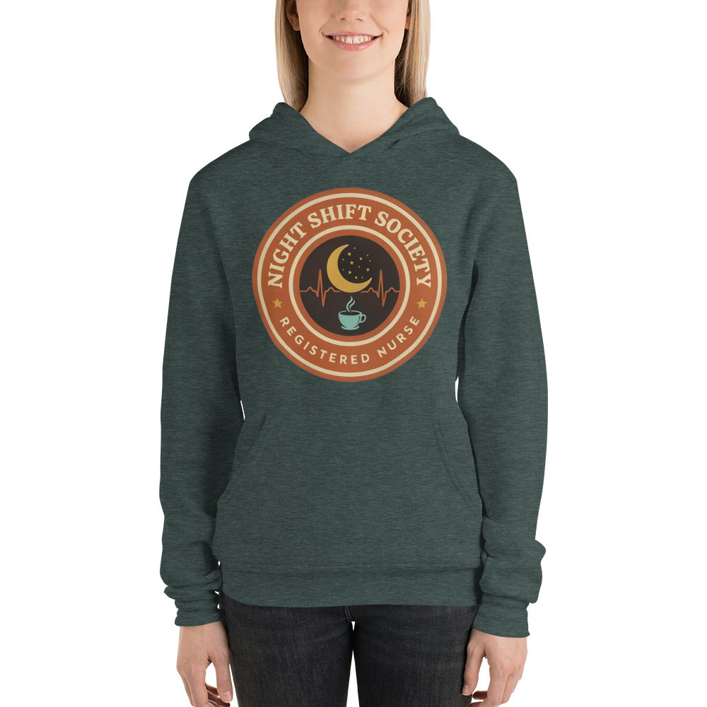 Night Shift Society retro registered nurse badge hoodie — Heather Forest, on model