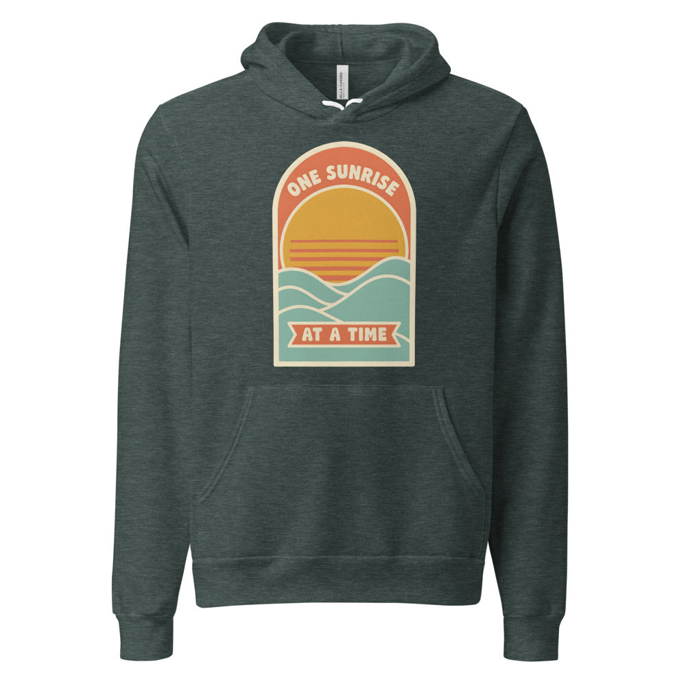 One Sunrise at a Time retro sunrise hoodie — Heather Forest, front