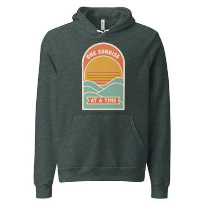 One Sunrise at a Time retro sunrise hoodie — Heather Forest, front