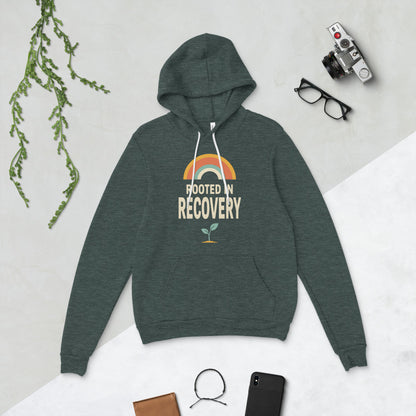 Rooted in Recovery retro rainbow hoodie — Heather Forest, flat lay