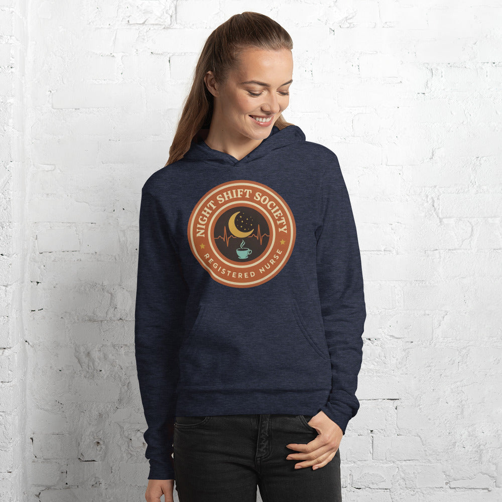 Night Shift Society retro registered nurse badge hoodie — Heather Navy, on model