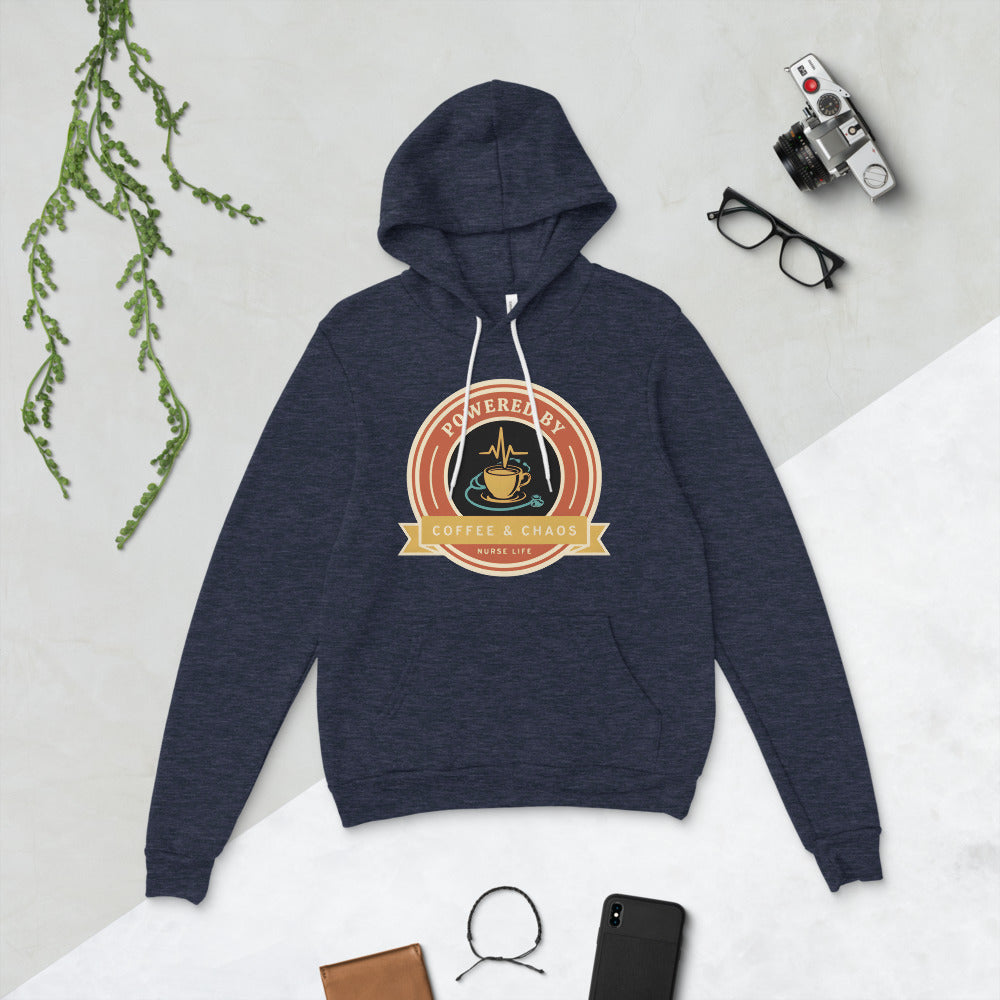 Powered by Coffee & Chaos retro nurse badge hoodie — Heather Navy, flat lay