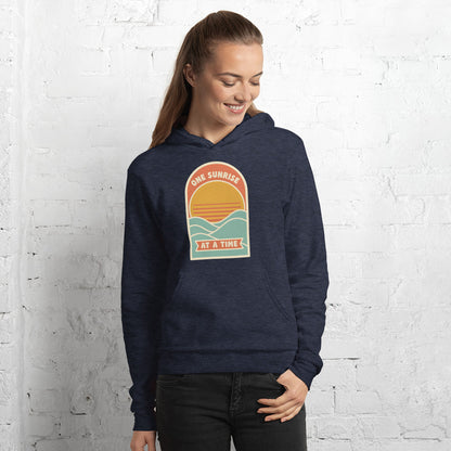 One Sunrise at a Time retro sunrise hoodie — Heather Navy, on model