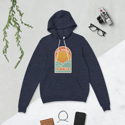 One Sunrise at a Time retro sunrise hoodie — Heather Navy, flat lay