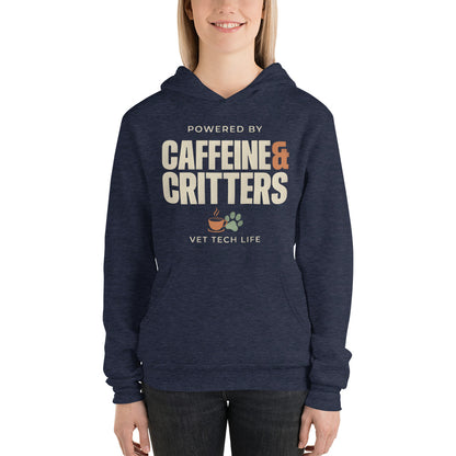 Powered by Caffeine & Critters funny vet tech hoodie — Heather Navy, on model