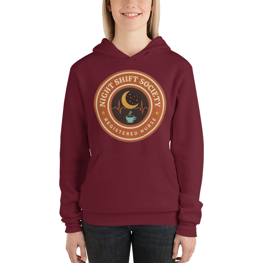 Night Shift Society retro registered nurse badge hoodie — Maroon, on model