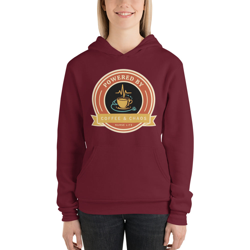 Powered by Coffee & Chaos retro nurse badge hoodie — Maroon, on model