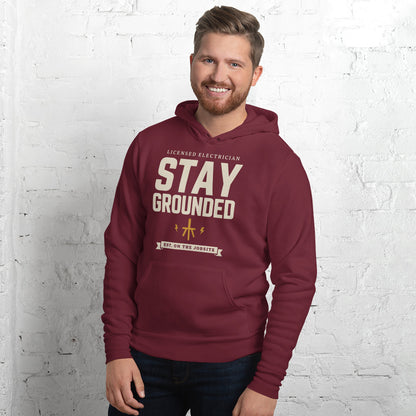 Stay Grounded funny electrician hoodie — Maroon, on model