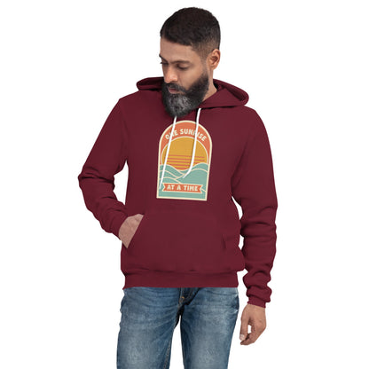 One Sunrise at a Time retro sunrise hoodie — Maroon, on model