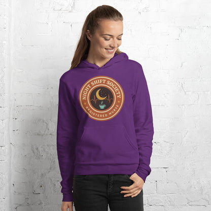 Night Shift Society retro registered nurse badge hoodie — Team Purple, on model