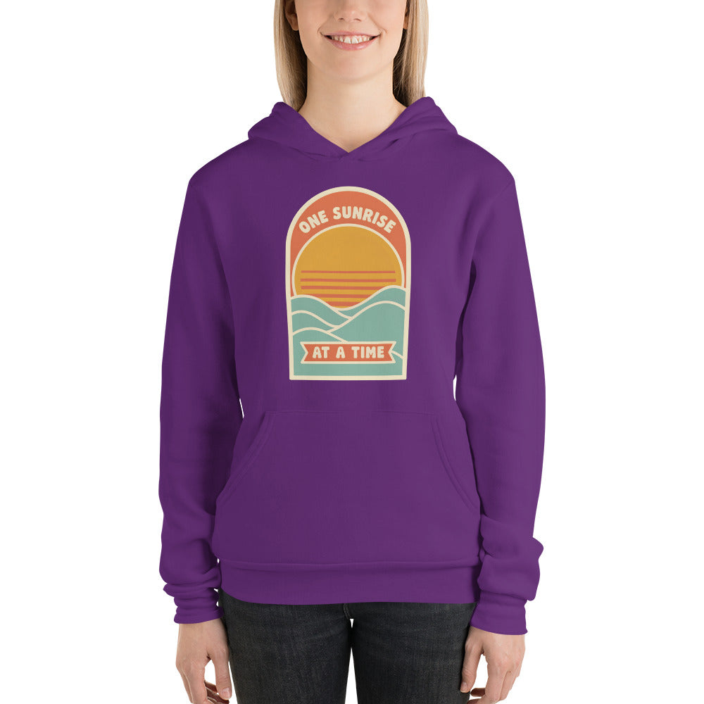 One Sunrise at a Time retro sunrise hoodie — Team Purple, on model