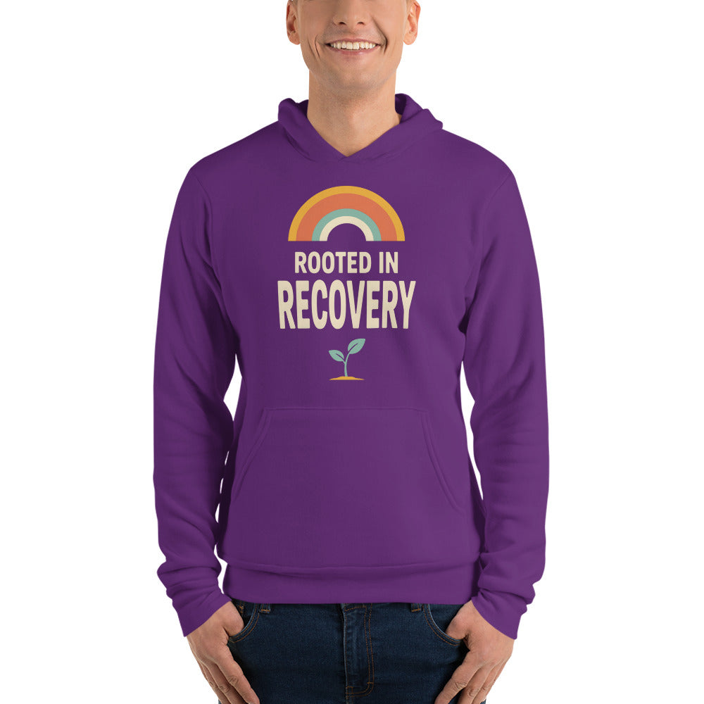 Rooted in Recovery retro rainbow hoodie — Team Purple, on model