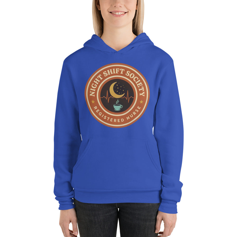 Night Shift Society retro registered nurse badge hoodie — True Royal, on model
