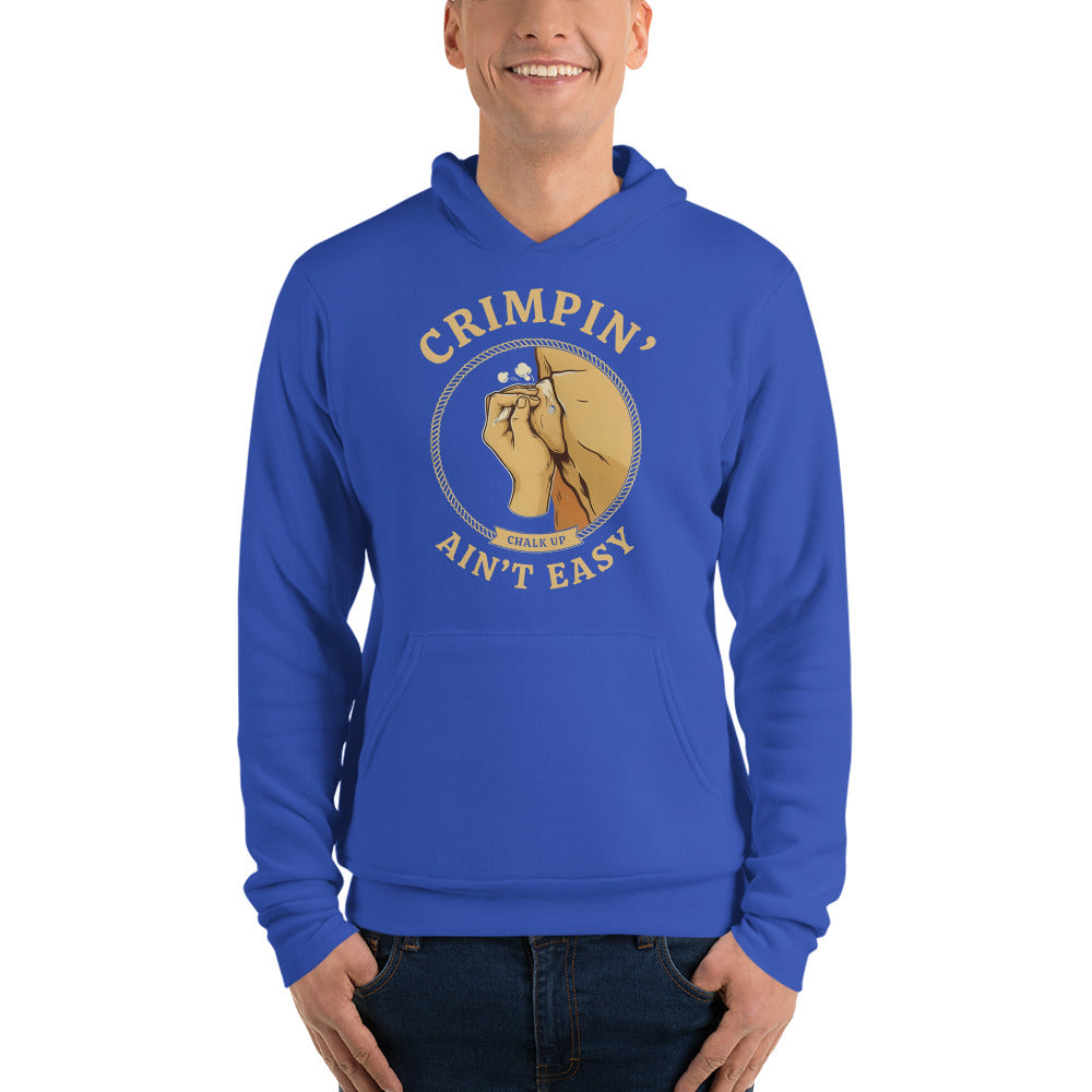 Crimpin' Ain't Easy bouldering badge hoodie — True Royal, on model