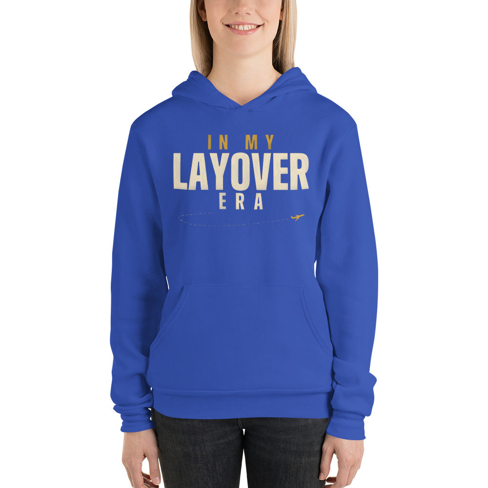 In My Layover Era flight attendant hoodie — True Royal, on model