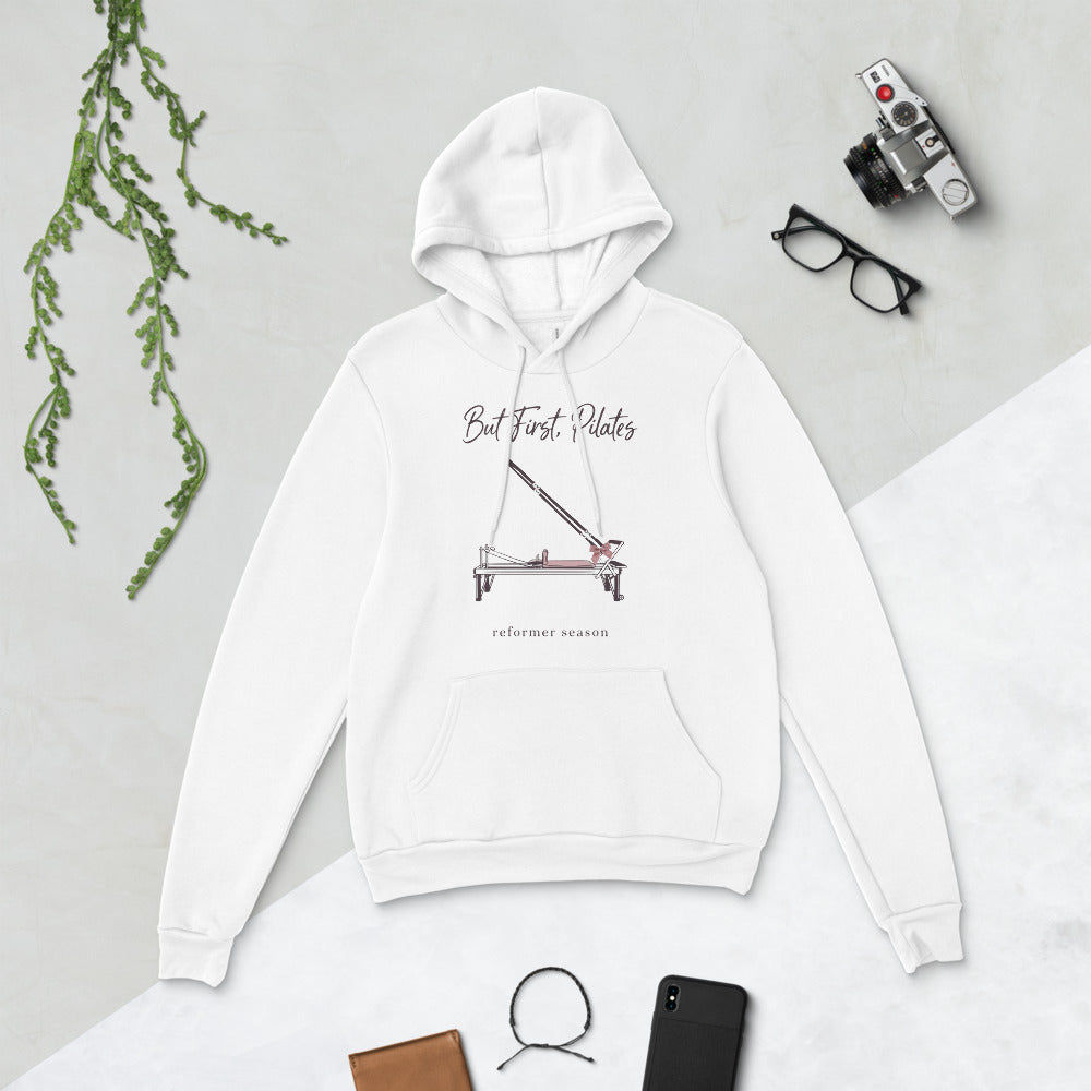 But First Pilates reformer line-art hoodie — White, flat lay