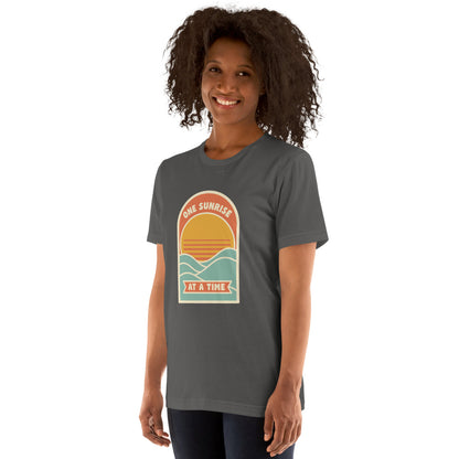 One Sunrise at a Time retro sunrise tee — Asphalt, on model