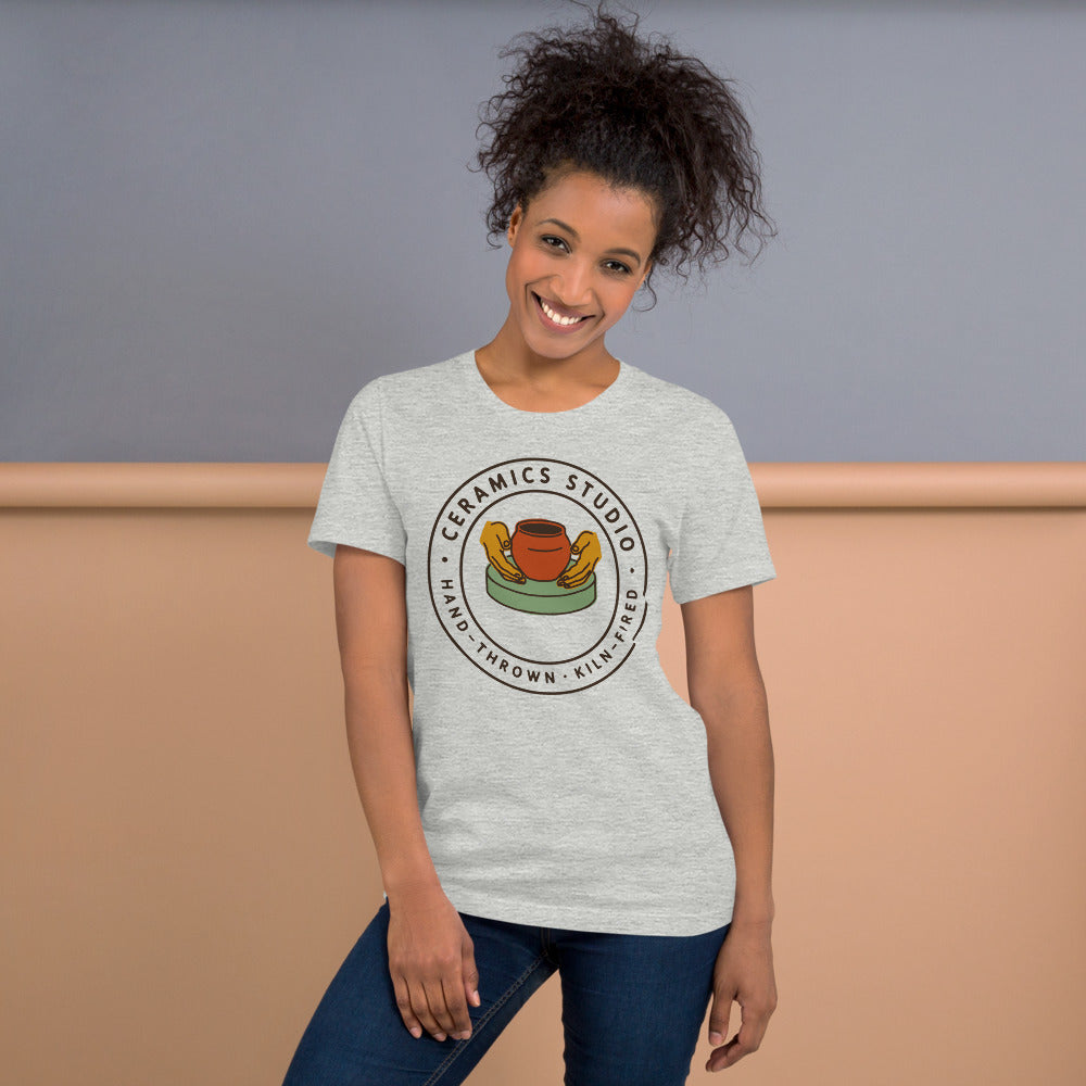 Ceramics Studio Badge hand-thrown pottery t-shirt — Athletic Heather, on model