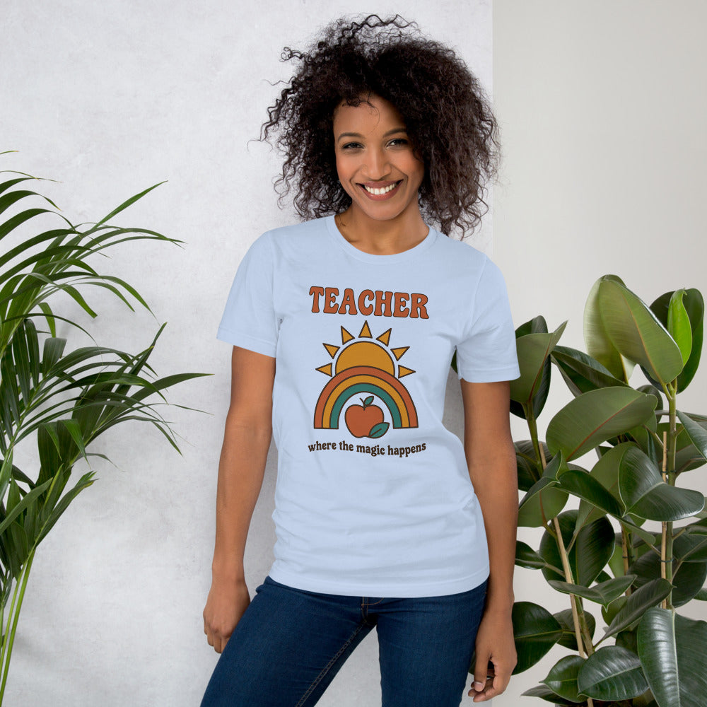 Teacher Where The Magic Happens retro groovy teacher tee — Baby Blue, on model
