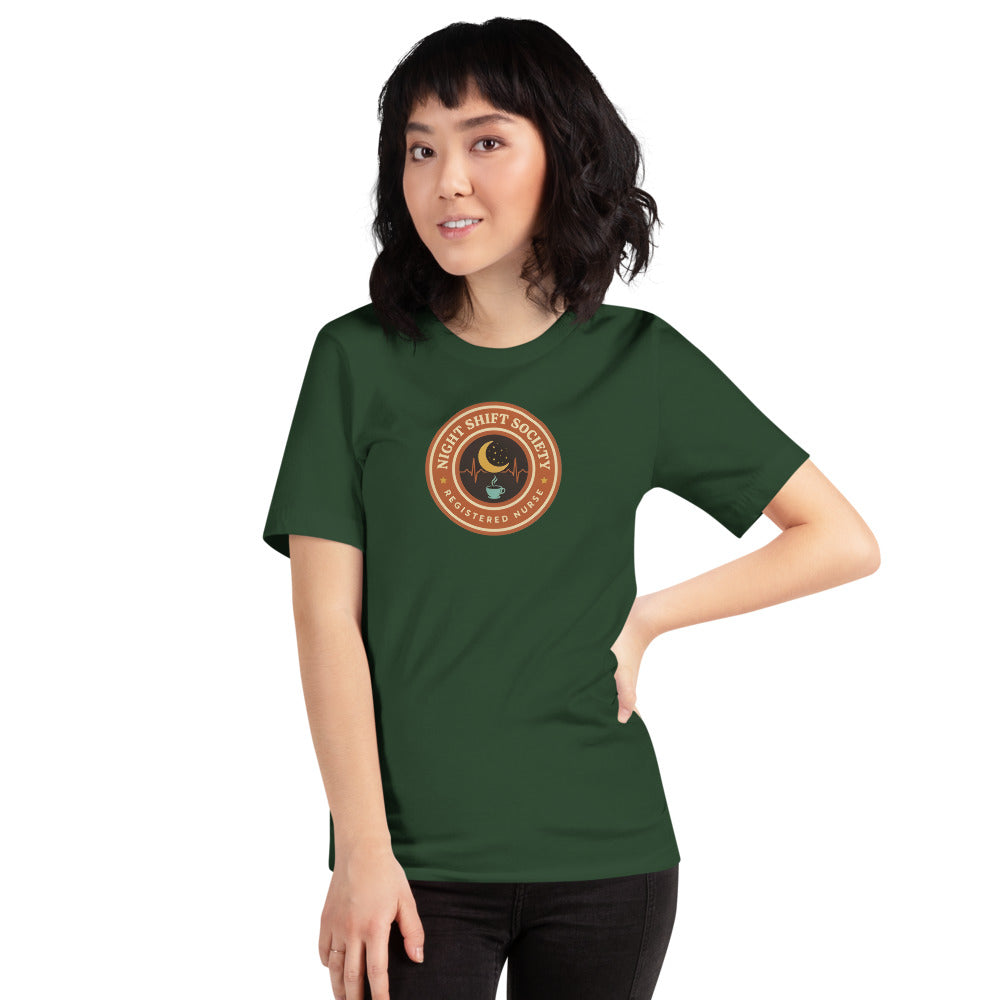 Night Shift Society retro registered nurse badge tee — Forest, on model