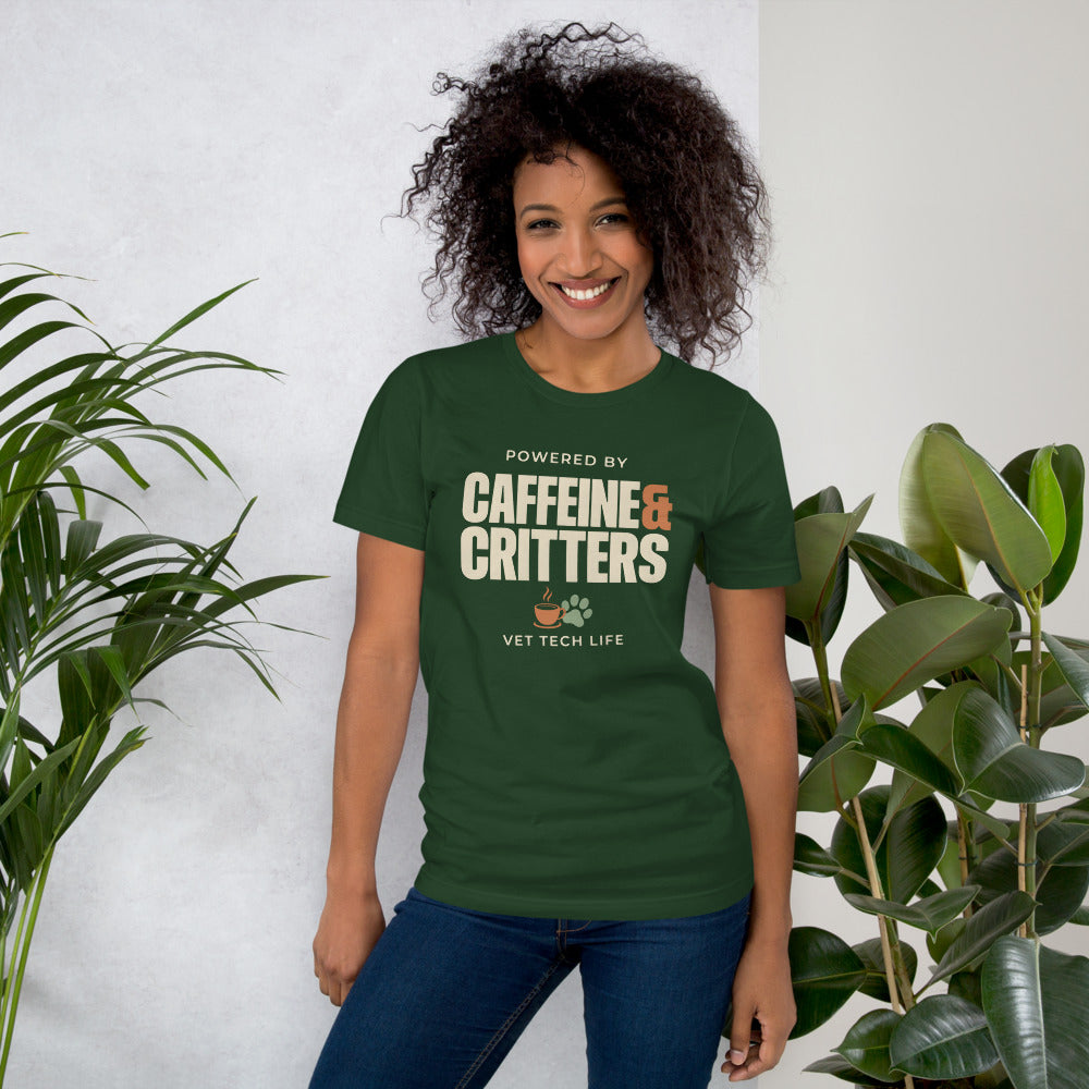 Powered by Caffeine & Critters funny vet tech tee — Forest, on model