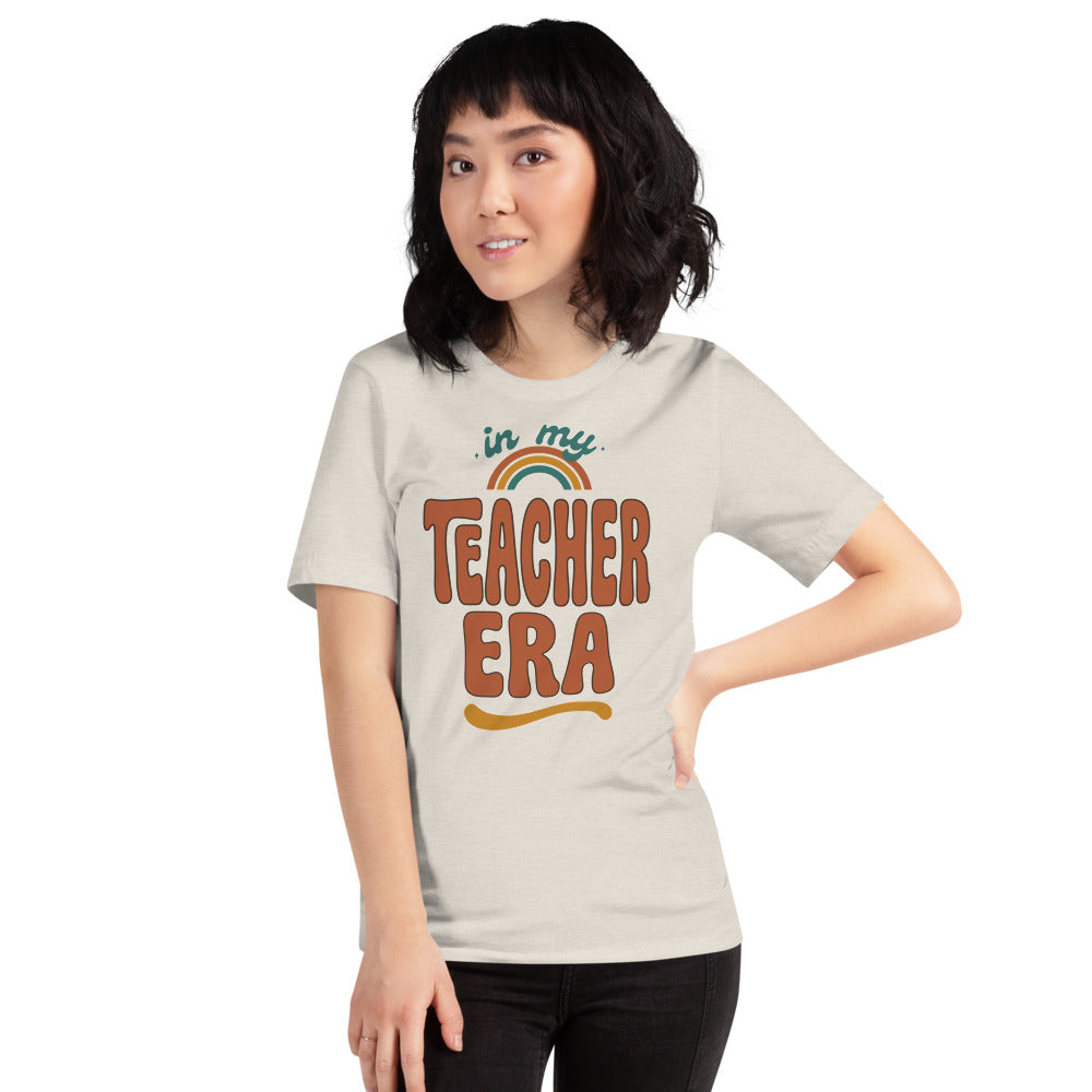 In My Teacher Era retro groovy teacher tee — Heather Dust, on model