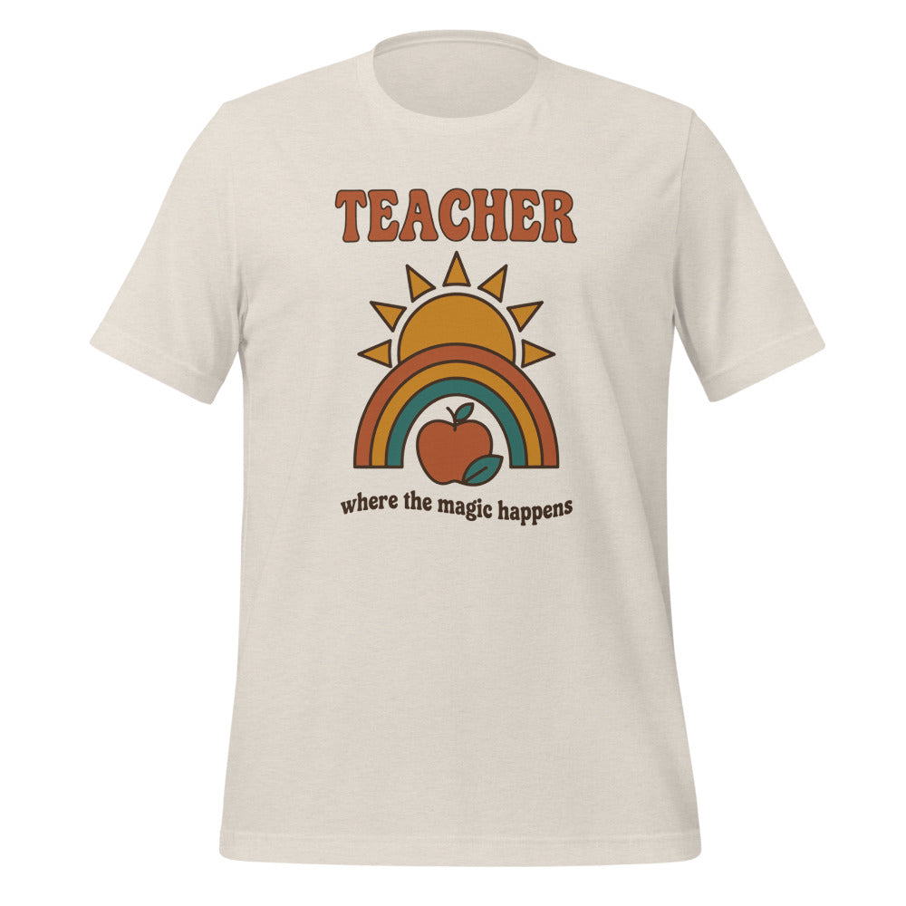 Teacher Where The Magic Happens retro groovy teacher tee — Heather Dust, front