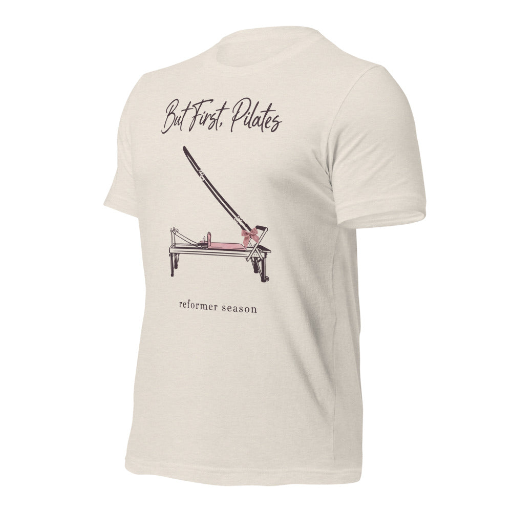 But First Pilates reformer line-art tee — Heather Dust, front-right