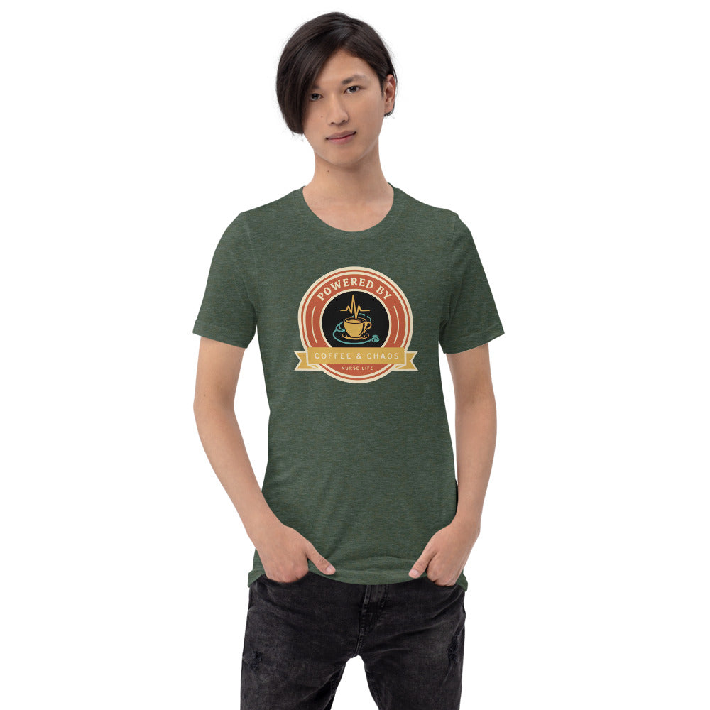 Powered by Coffee & Chaos retro nurse badge tee — Heather Forest, on model