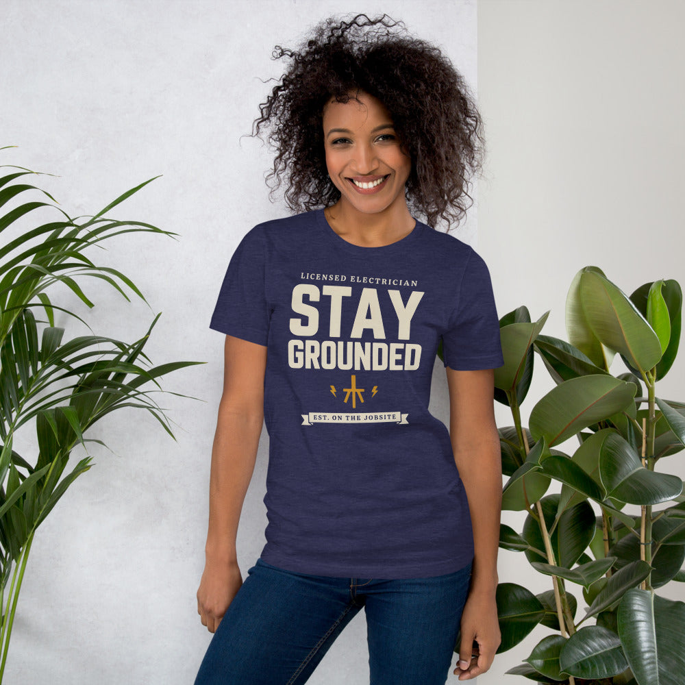 Stay Grounded funny electrician tee — Heather Midnight Navy, on model