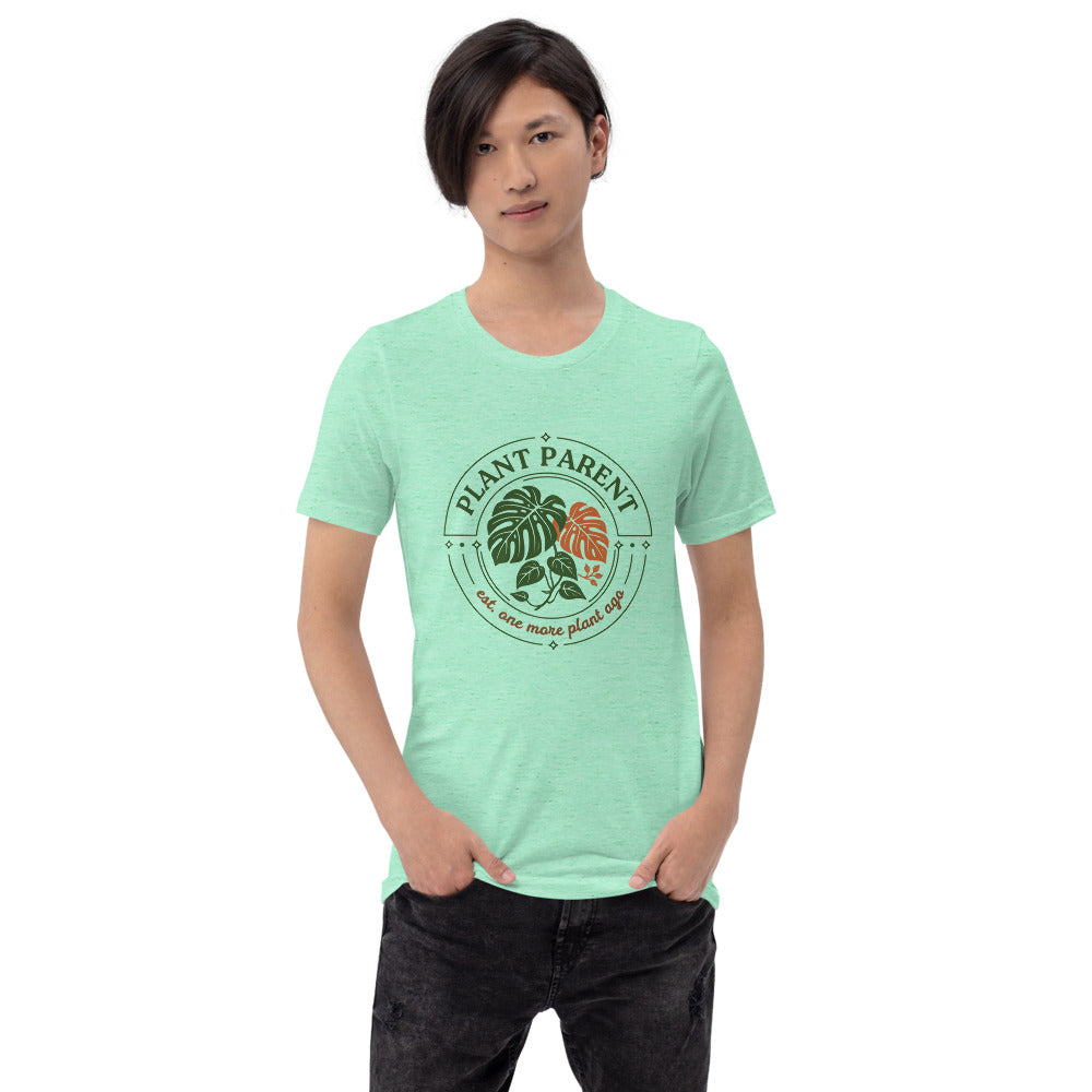 Model wearing the Plant Parent retro botanical badge tee — Heather Mint