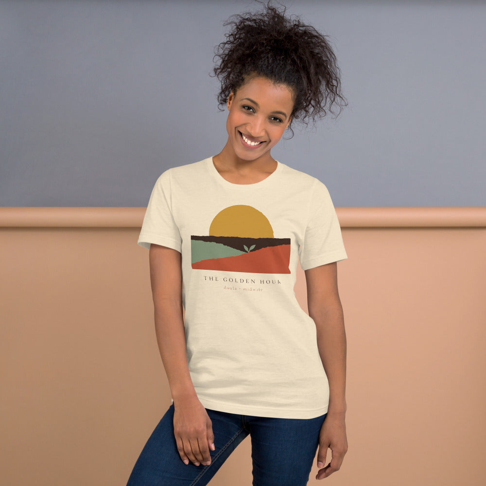The Golden Hour birth worker doula t-shirt — Heather Natural, on model