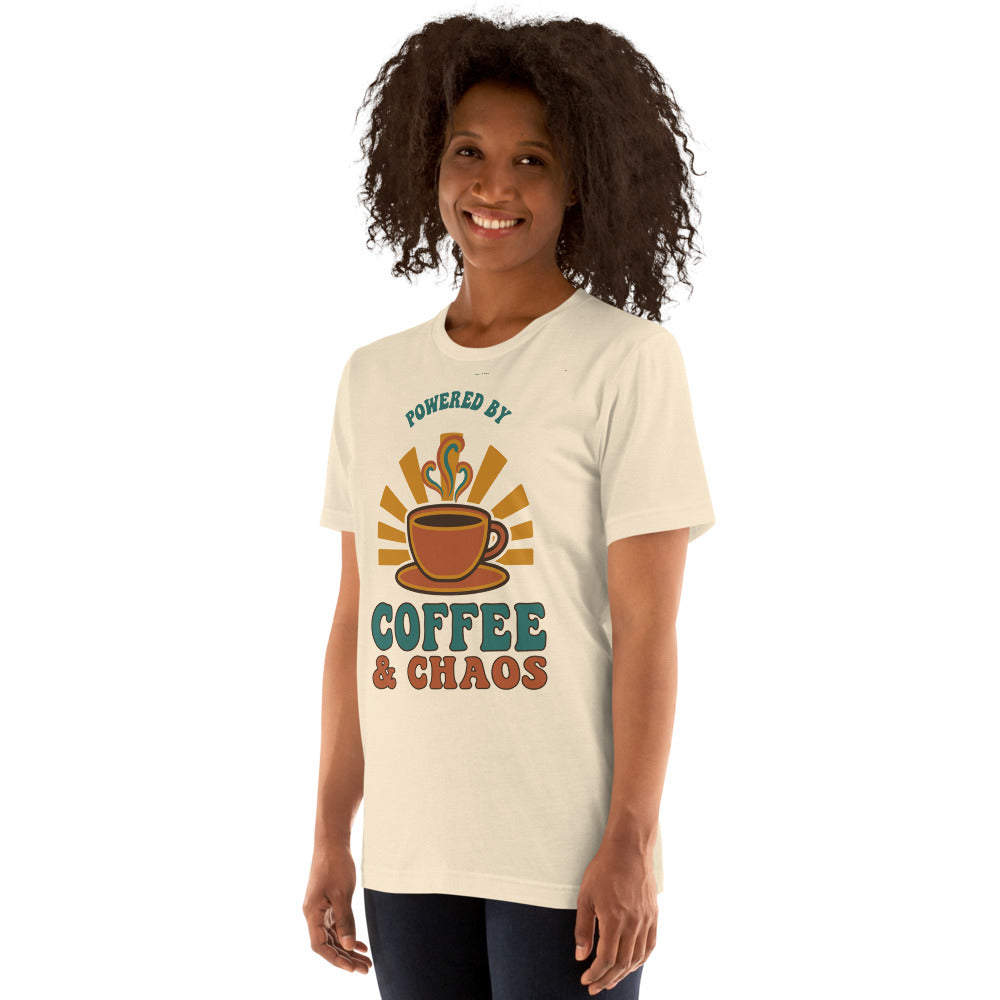 Powered By Coffee And Chaos retro groovy teacher tee — Heather Natural, on model