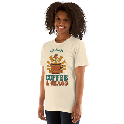 Powered By Coffee And Chaos retro groovy teacher tee — Heather Natural, on model