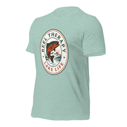 Reel Therapy retro national-park trout badge fishing tee — Heather Prism Dusty Blue, front-right