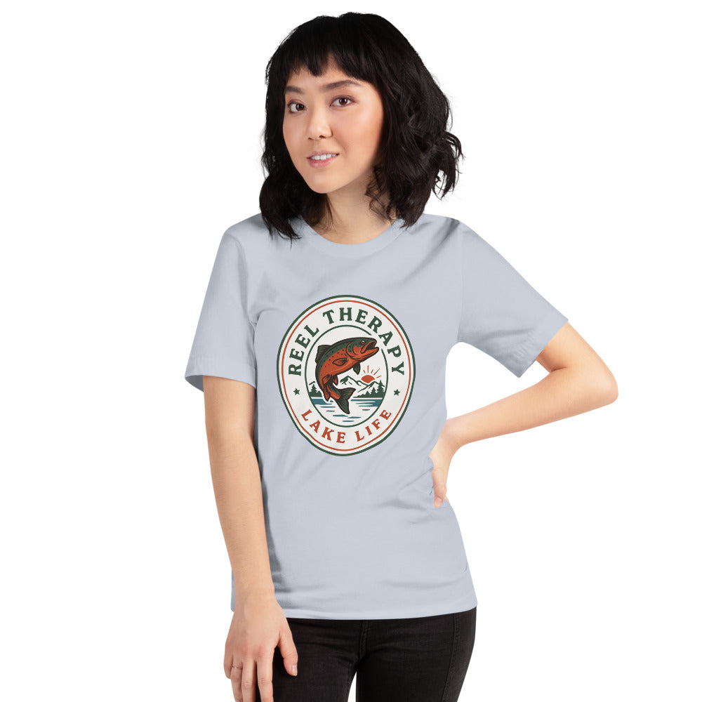 Reel Therapy retro national-park trout badge fishing tee — Light Blue, on model