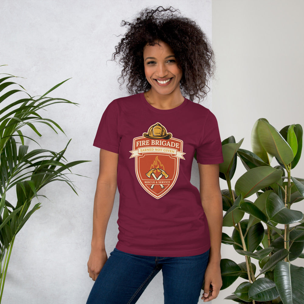 Fire Brigade Earned Not Given retro firefighter shield emblem tee — Maroon, on model