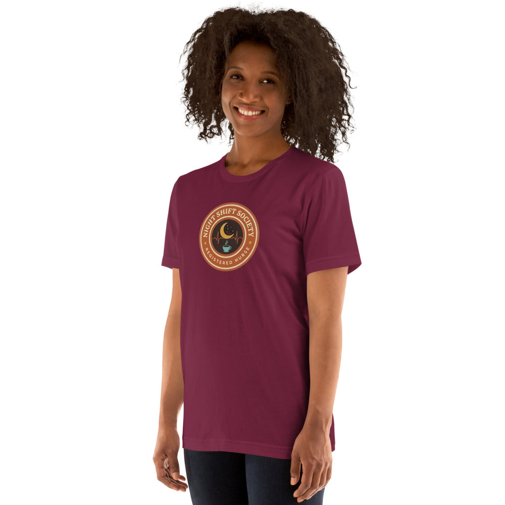 Night Shift Society retro registered nurse badge tee — Maroon, on model