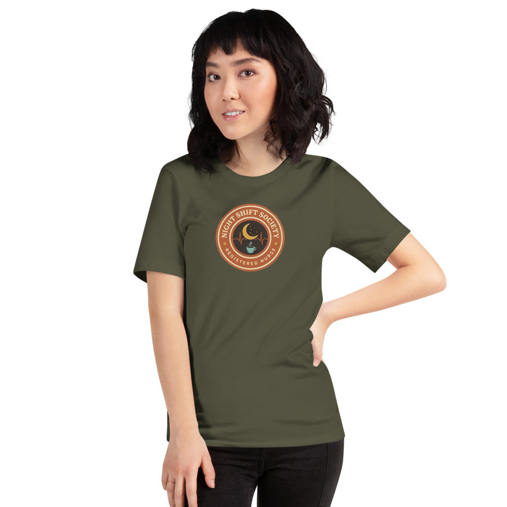Night Shift Society retro registered nurse badge tee — Military Green, on model