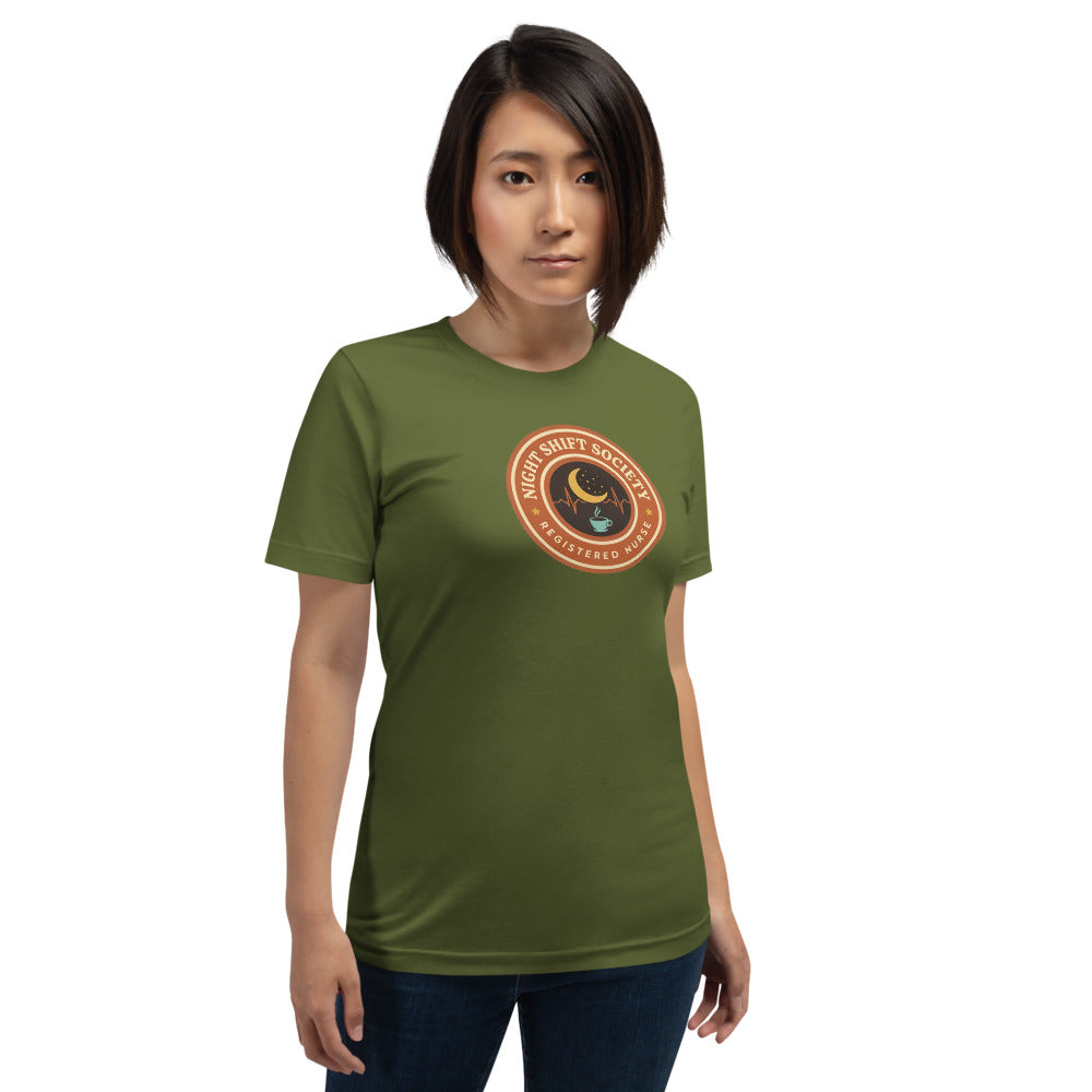 Night Shift Society retro registered nurse badge tee — Olive, on model