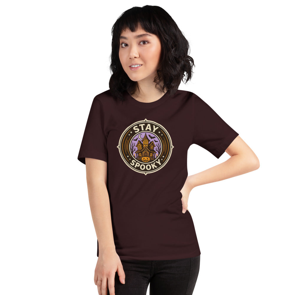 Stay Spooky retro Halloween vintage badge tee — Oxblood Black, on model