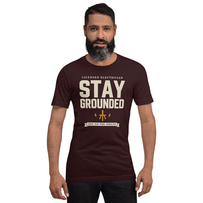 Stay Grounded funny electrician tee — Oxblood Black, on model