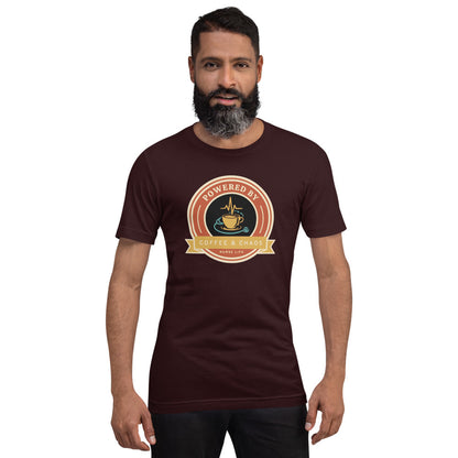 Powered by Coffee & Chaos retro nurse badge tee — Oxblood Black, on model